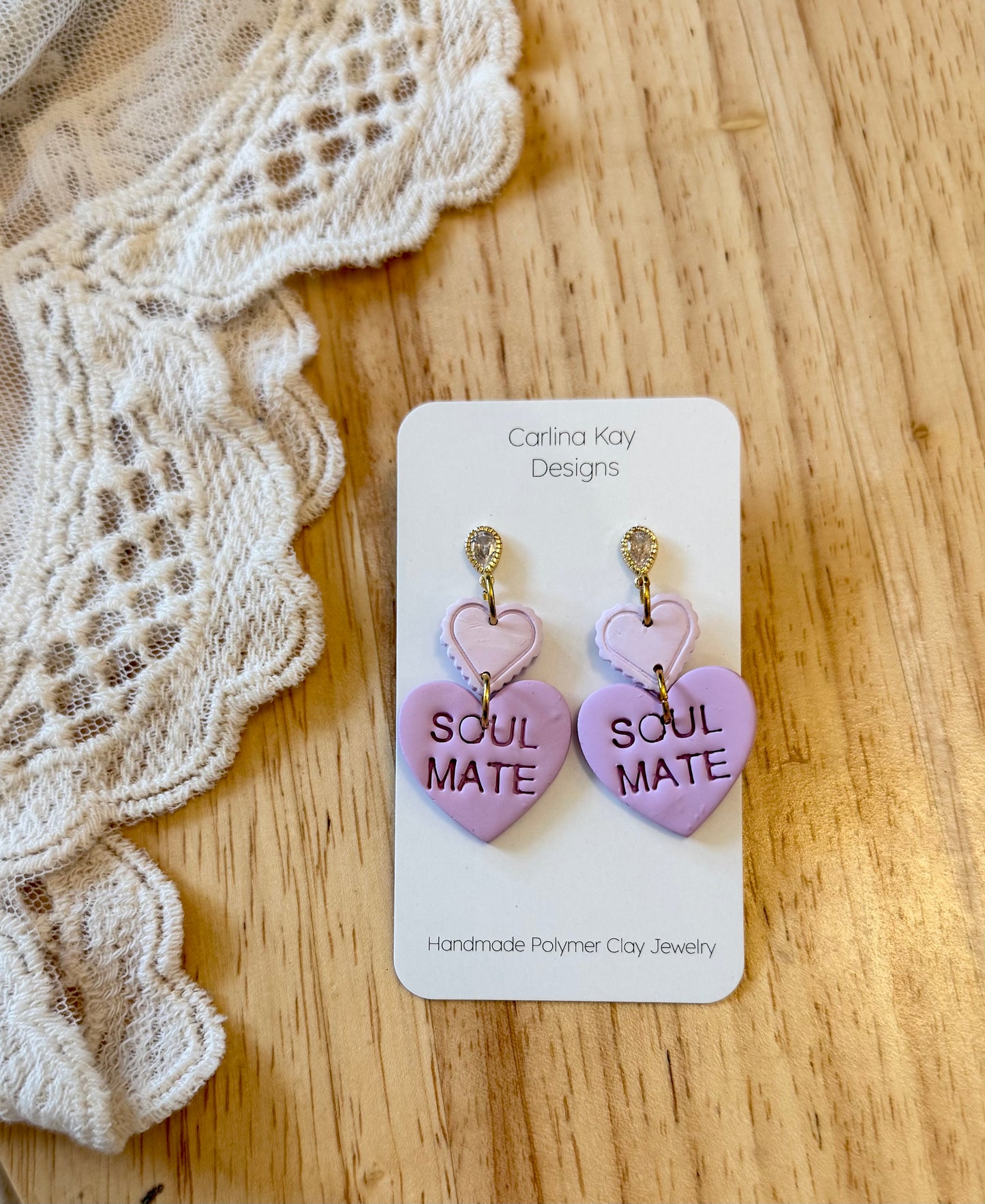 Soul mate stacked Purple Heart earrings.