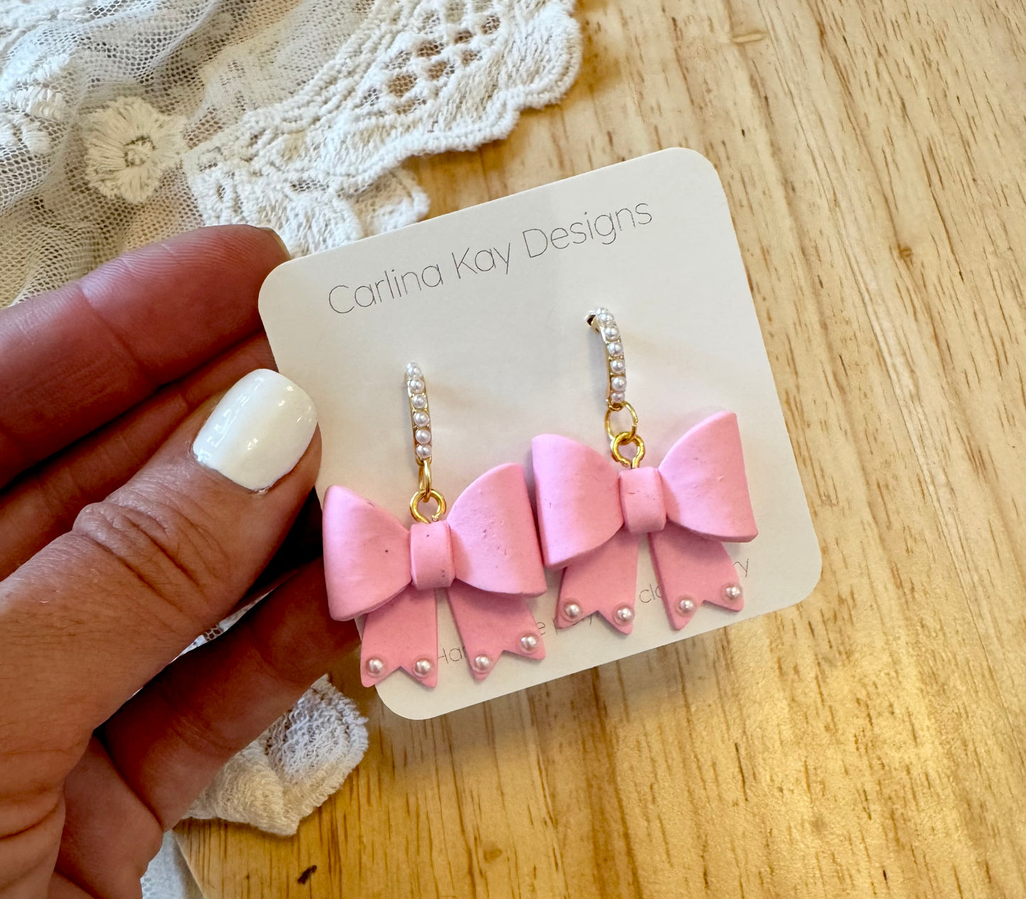 Light pink bows with pearl drop down earring posts