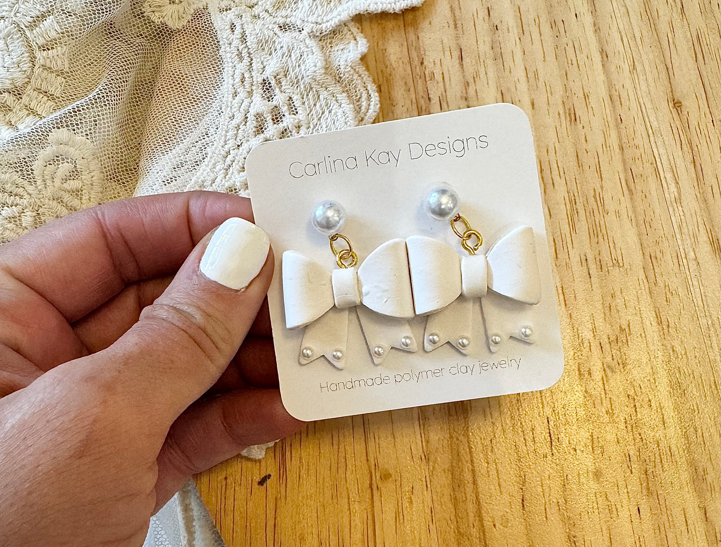 White pearl bow earrings