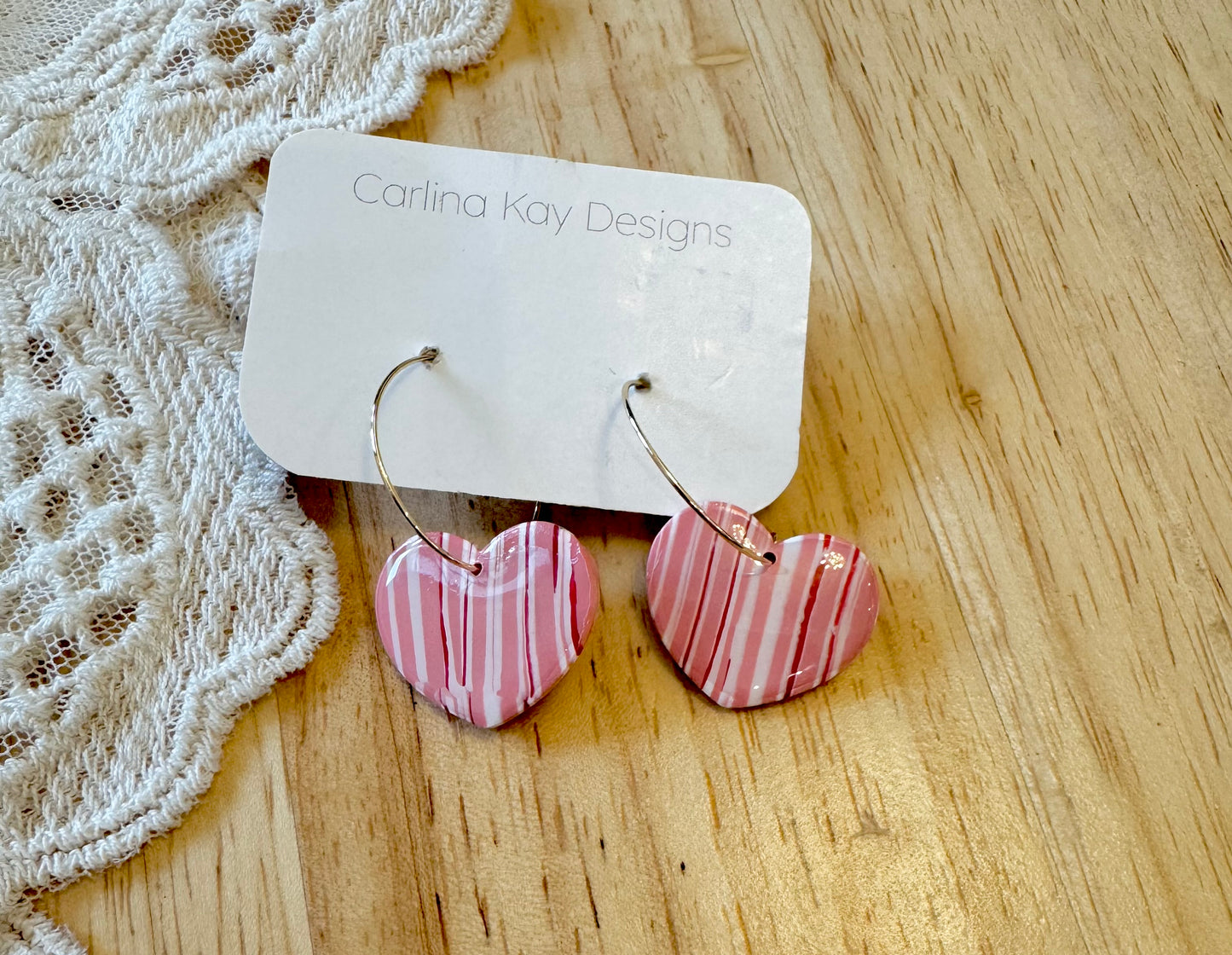 Striped large red, white, and pink heart earrings
