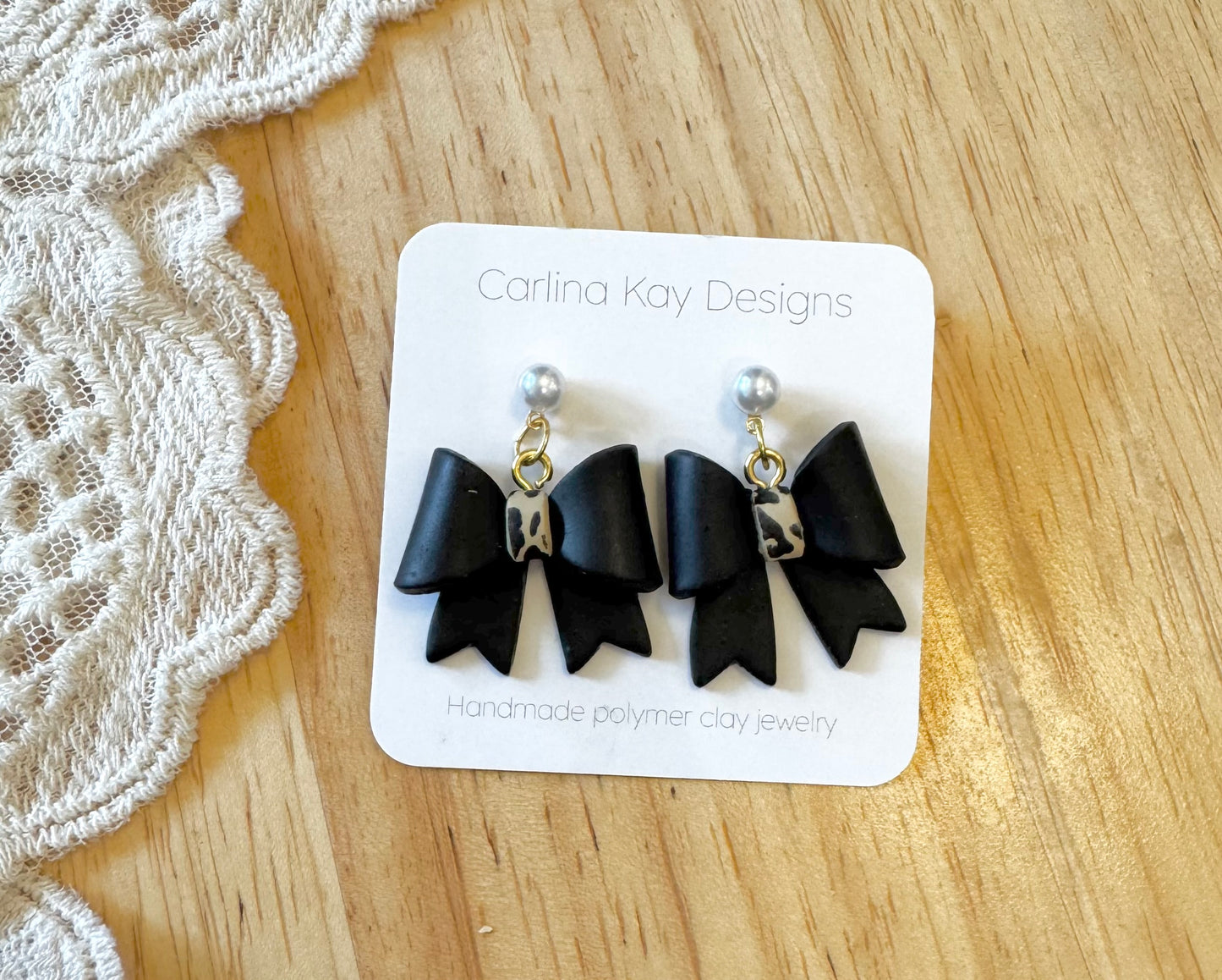 Black and leopard print bow earrings