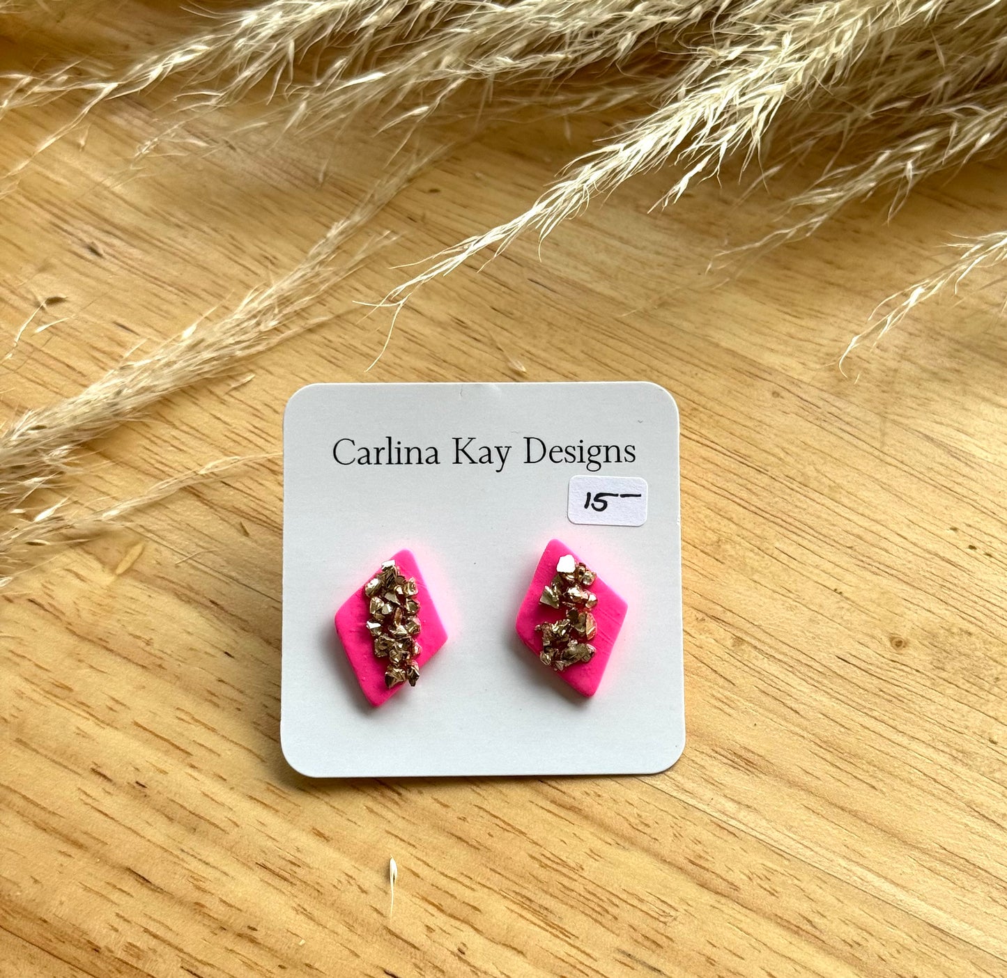 Hot pink and gold diamond studs