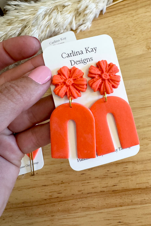 Bright coral flower arches