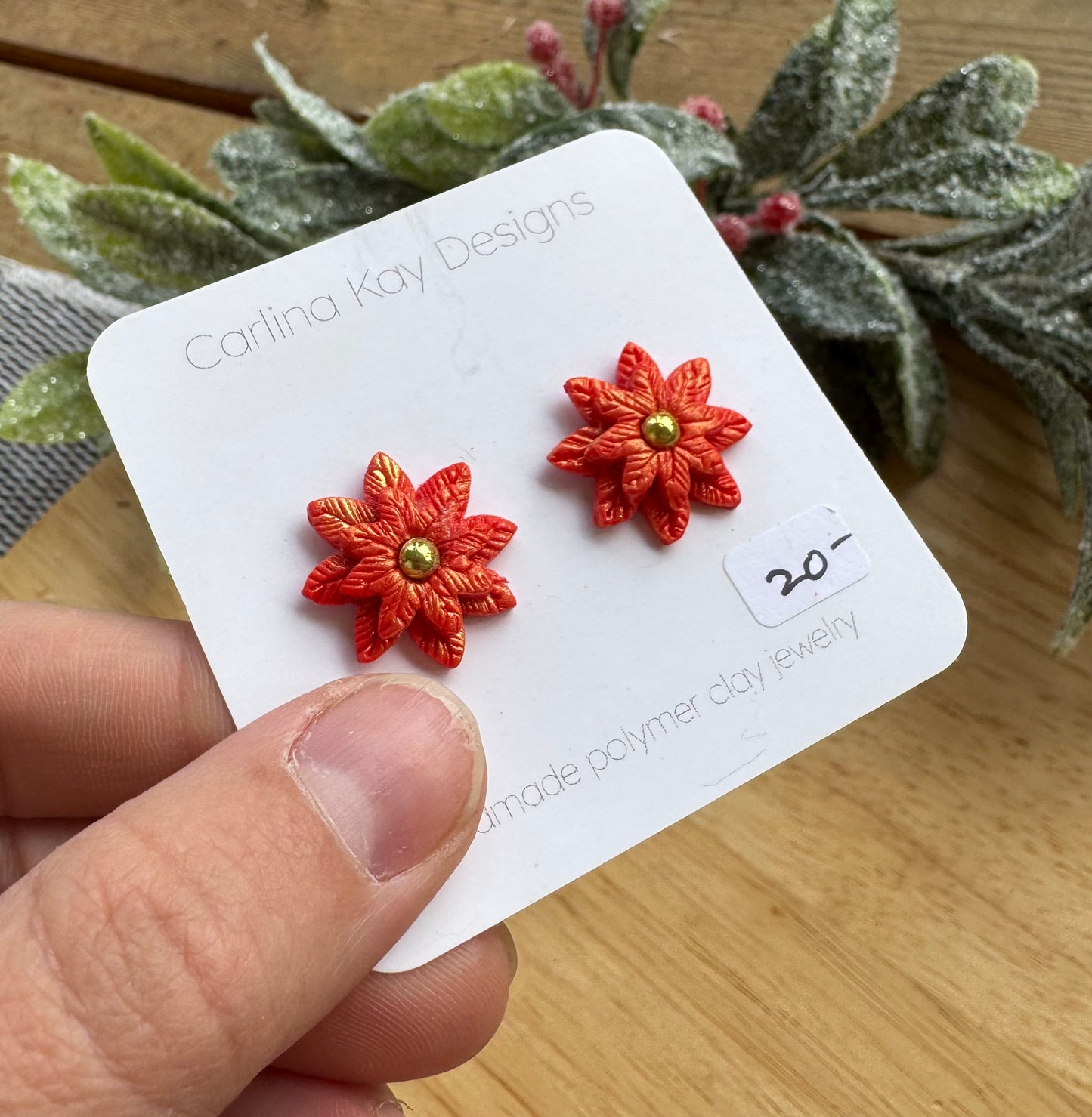 Poinsettia stud earrings with one gold bead