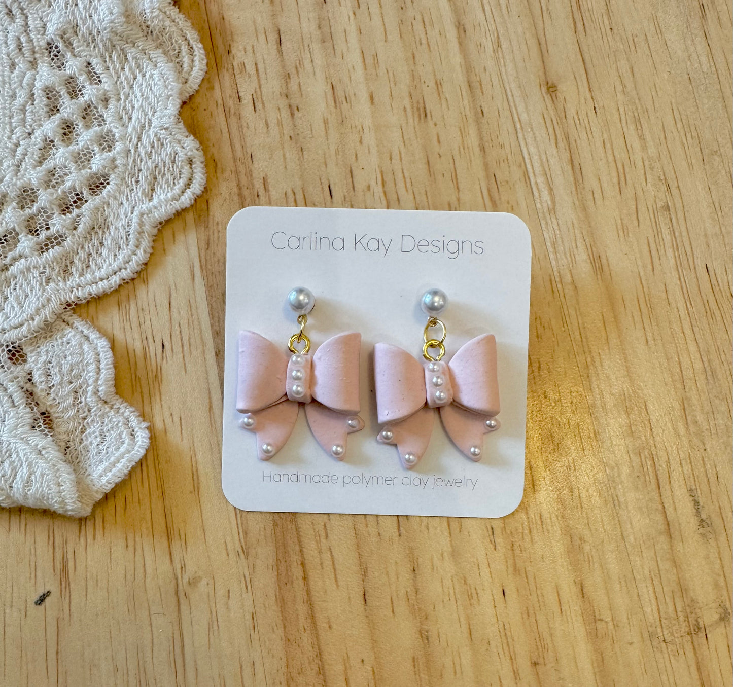 Pale pink bows with pearls
