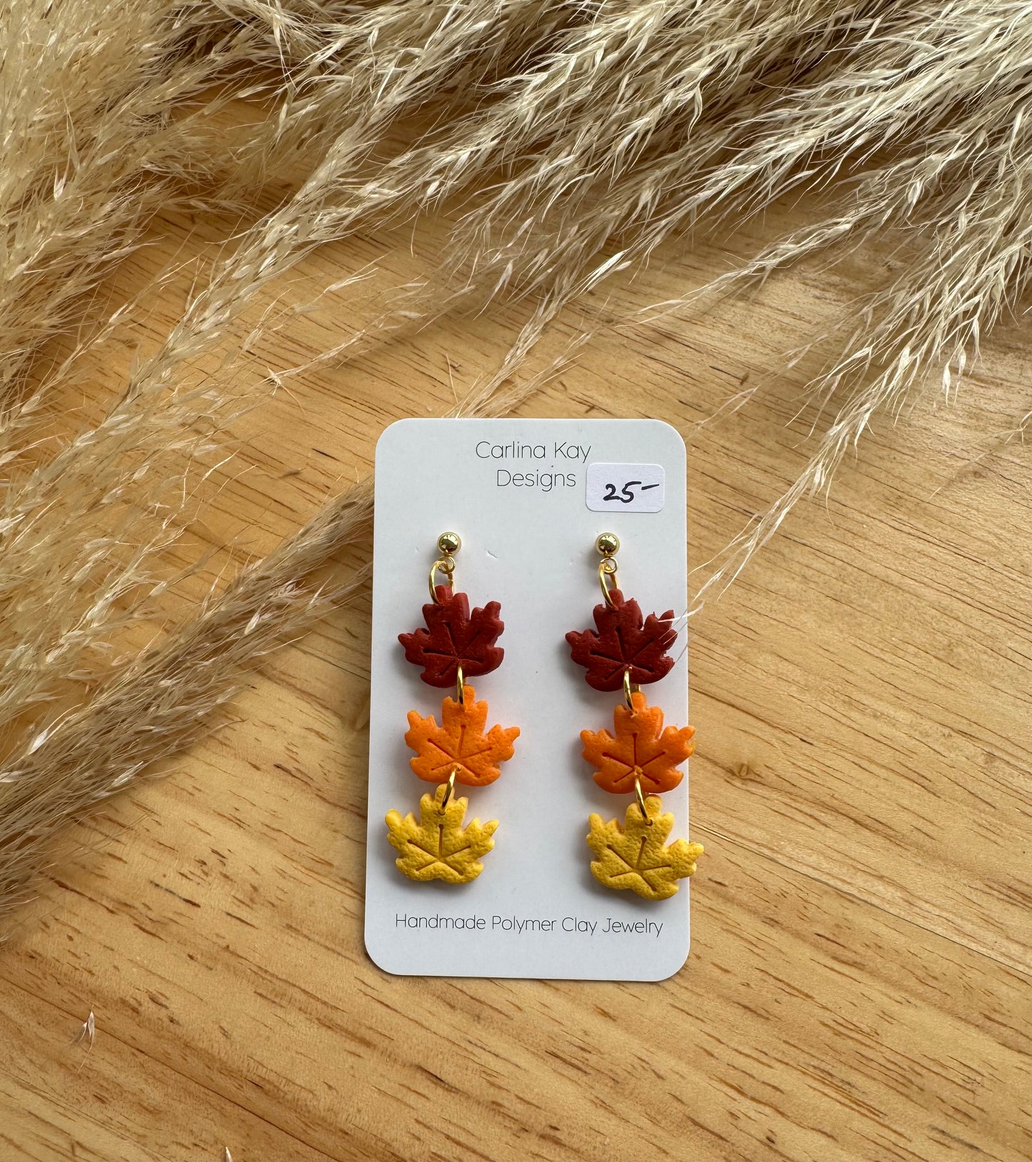 Three leaf stacked drop down earrings