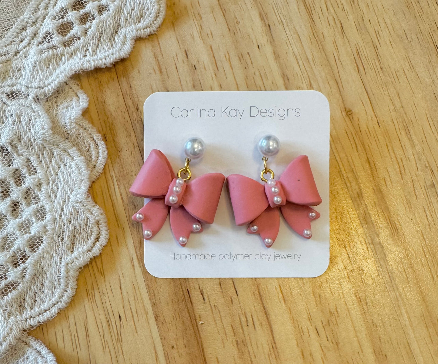 Rose pink pearl bow earrings
