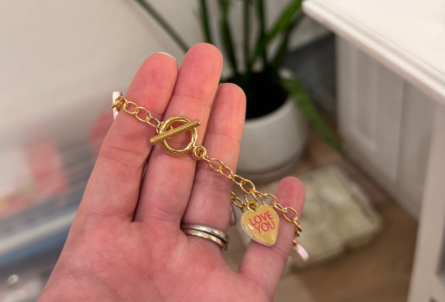 Gold conversation heart charm bracelet